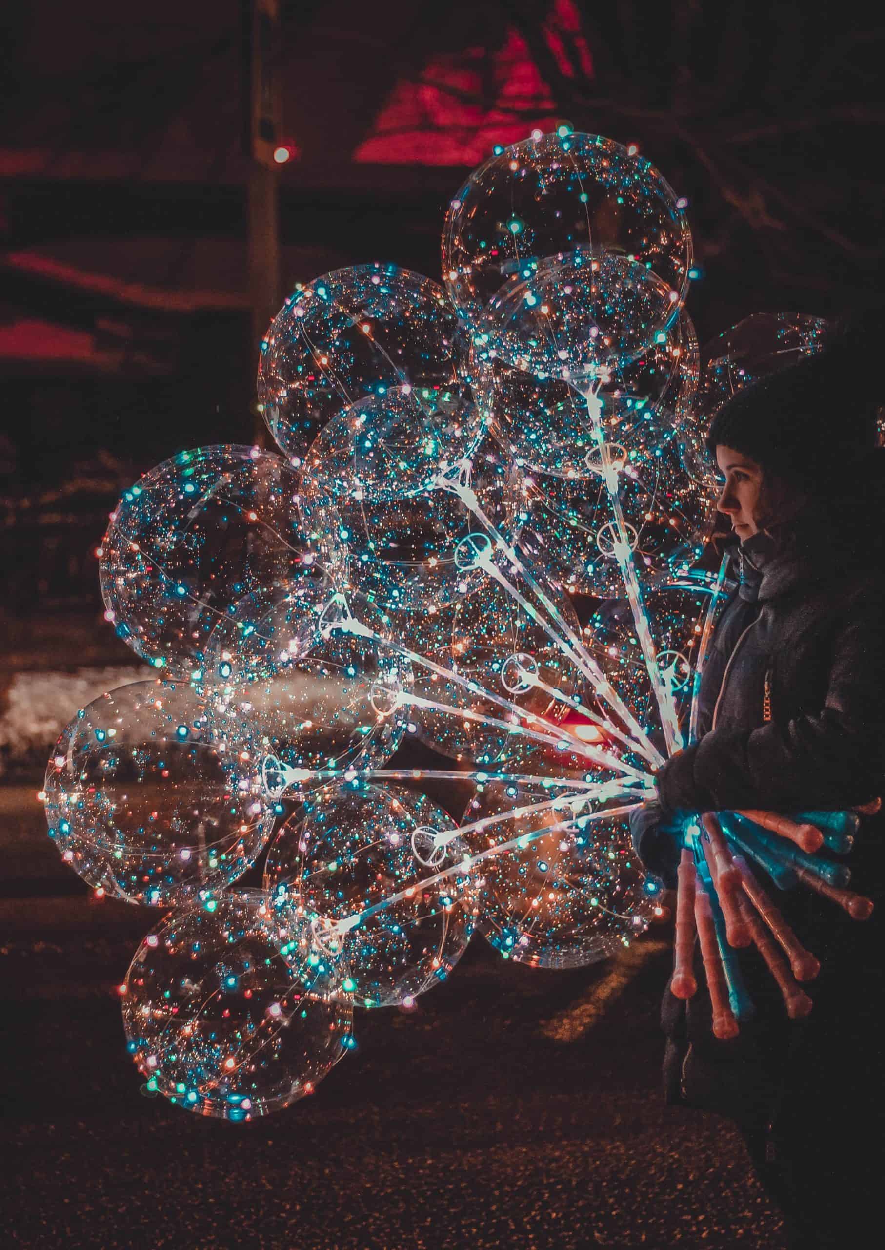 Girl holding sparkly balloons - Payreel