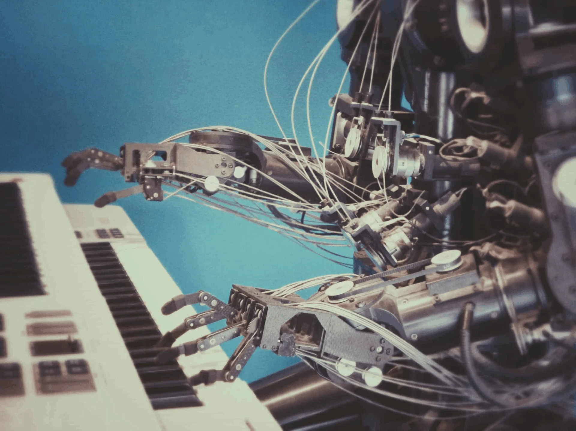 Robots typing on piano keyboard