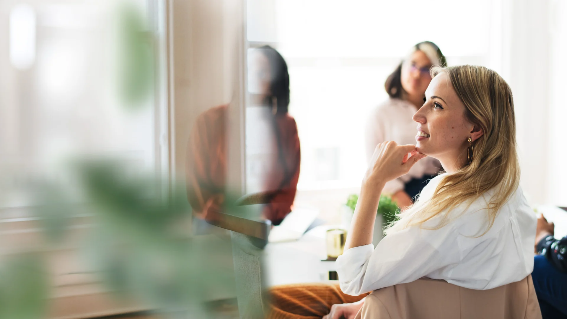 women sitting in a meeting