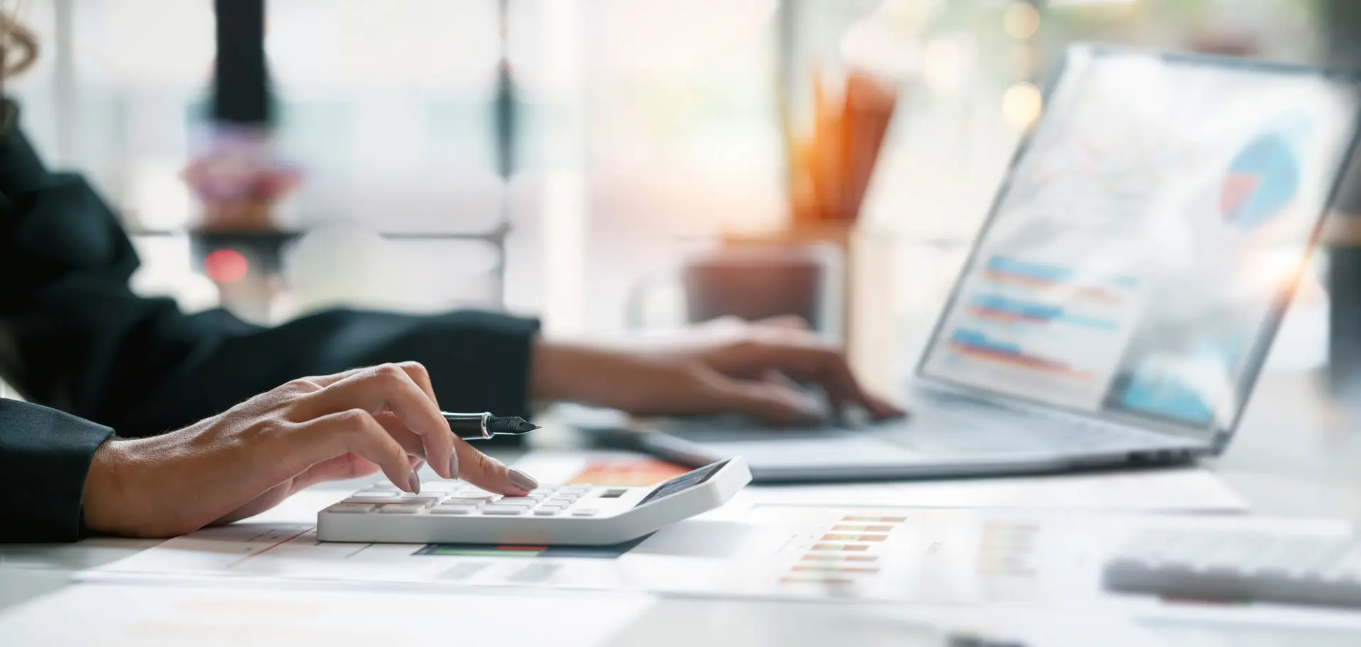 Businesswoman or accountant working Financial investment on calculator, calculate, analyze business and marketing growth on financial document data graph, Accounting, Economic, commercial concept.